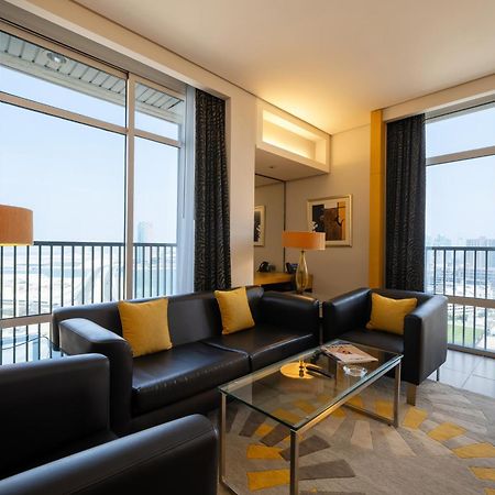 Hala Arjaan By Rotana, Deluxe Hotel Apartments Абу-Даби Экстерьер фото